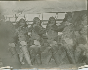 Image: Six Inuit women in dance line, aboard